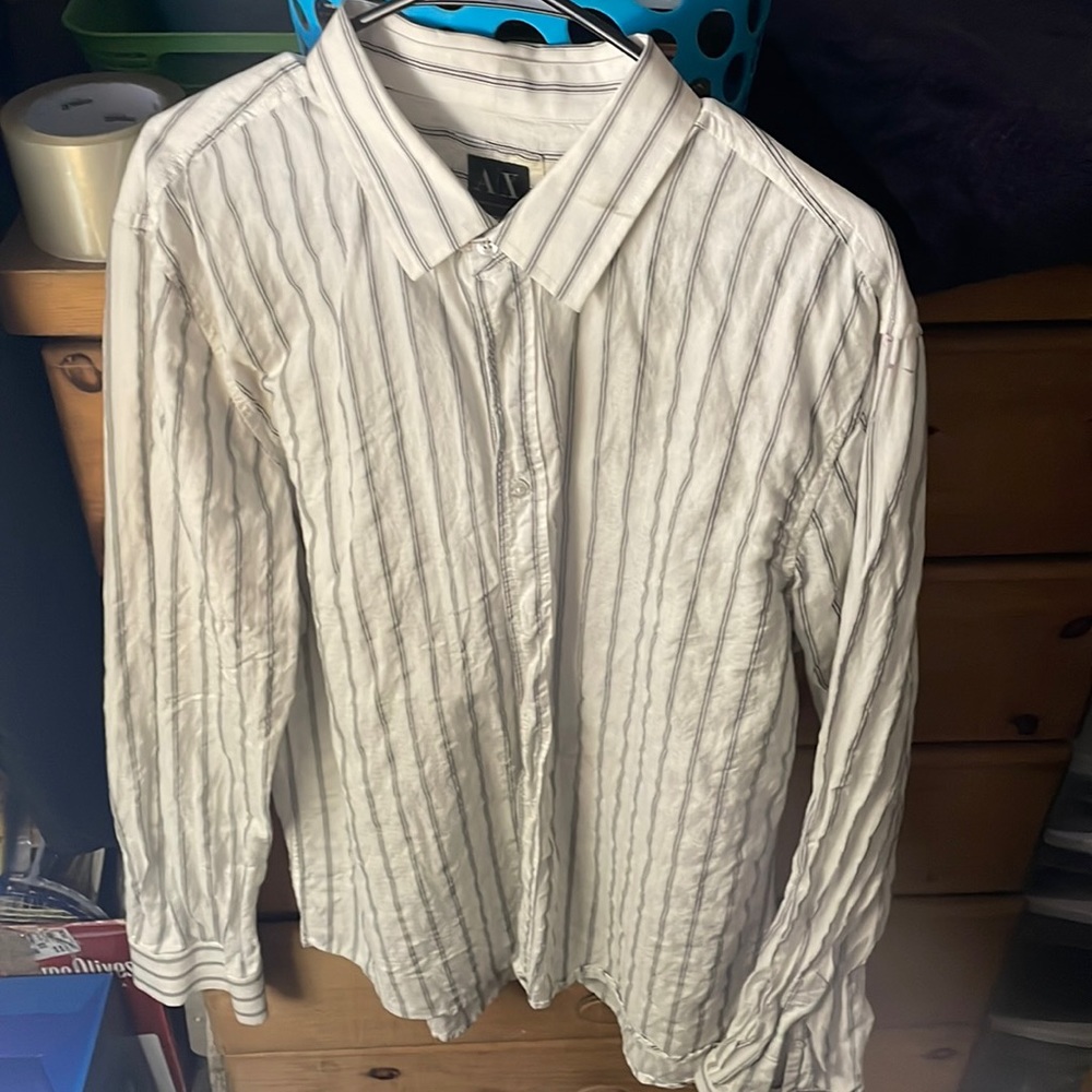Nice Armani exchange dress shirt, with a little small tear. Not very noticeable